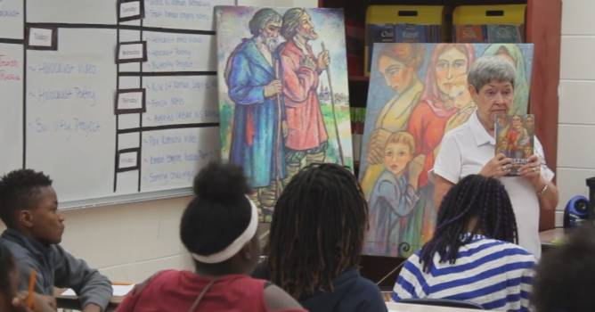 Presenting the Two Regimes book and artwork to a class